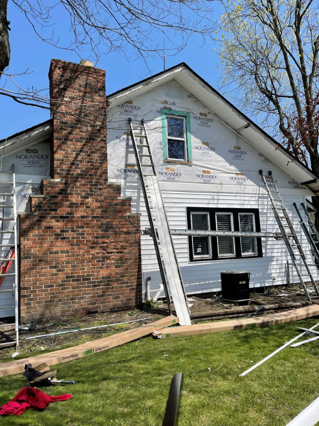Siding installation documented in Woodcreek Crossing